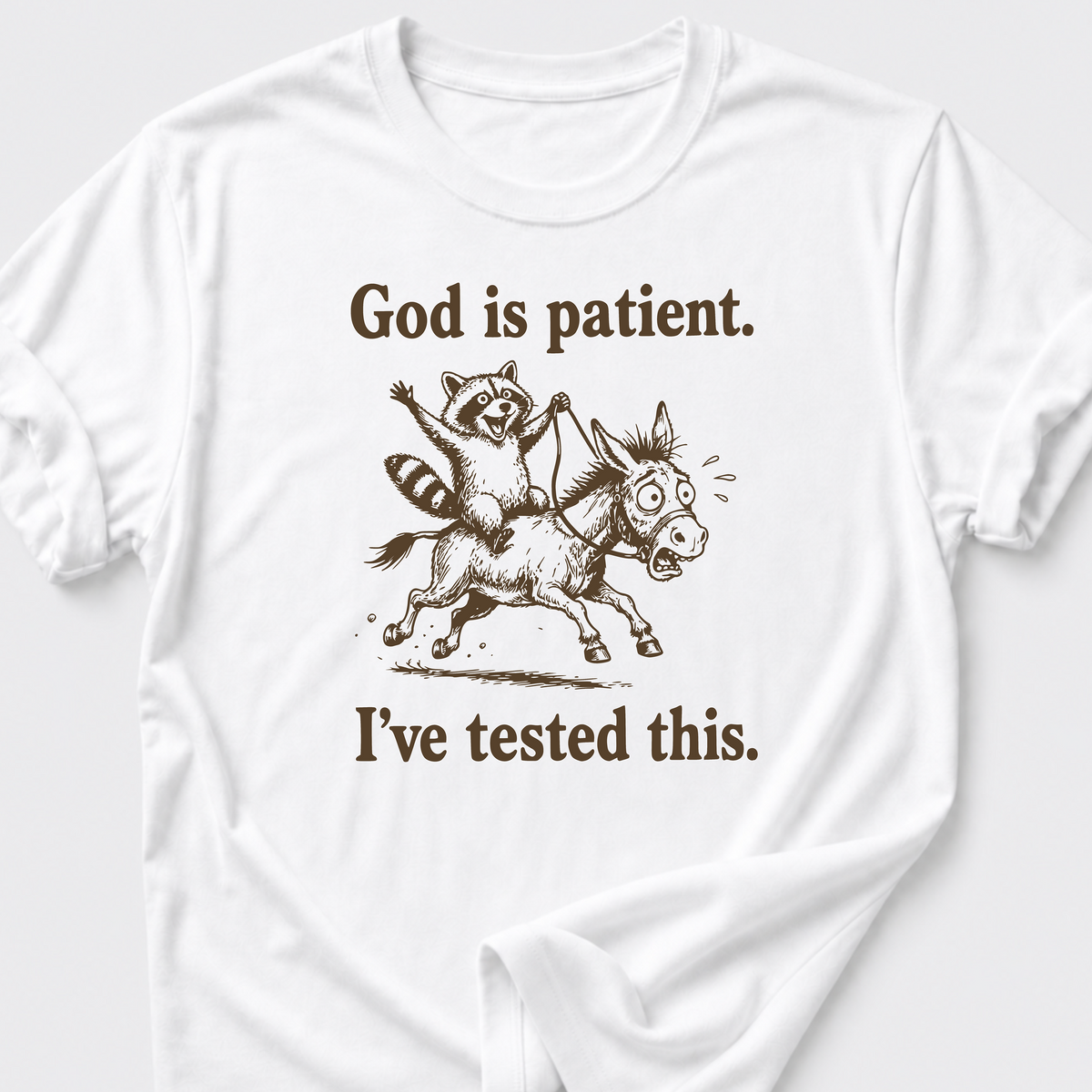 God is Patient. • Raccoon and Donkey T-Shirt